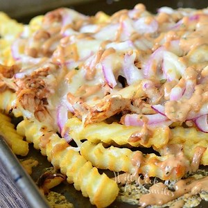 These BBQ Ranch Chicken Loaded Fries will make an AWESOME snack! Loaded with shredded rotisserie chicken, gooey cheese, red onion, BBQ sauce and topped with BBQ ranch dressing. FULL RECIPE: http://www.willcookforsmiles.com/2016/06/bbq-ranch-chicken-loaded-fries.html | Will Cook For Smiles
