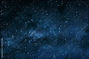 Starry night sky with countless stars and faint nebulae visible in the deep space