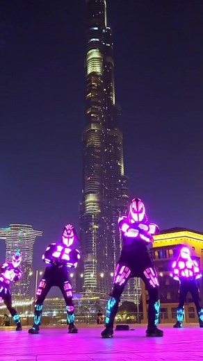 Futuristic Neon Dance Performance in Urban Nightscape