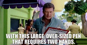 with this large, over-sized pen that requires two hands.