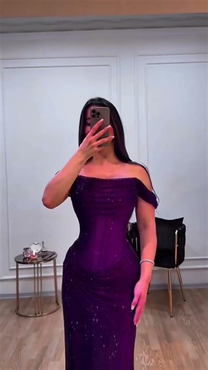 To order this purple gown DM A sculpted off-shoulder evening gown in luminous violet mesh,