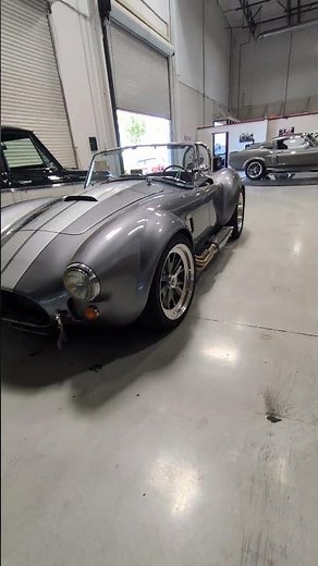 1965 Backdraft Racing Shelby Cobra – Coyote-Powered 5-Speed Roadster in Grey w/ Silver Stripes