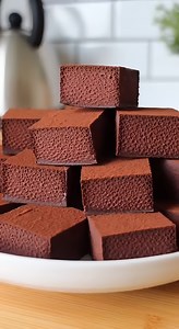 This two-ingredient wonder transforms airy Cool Whip whipped topping into rich, melt-in-your-mouth chocolate truffles with a signature cloud-like texture. PREP: 10 mins | CHILL: 4 hours | SERVES: 16 TEMP: N/A 🛒 INGREDIENTS 12 oz Semi-sweet chocolate chips 8 oz Cool Whip whipped topping, frozen and thawed 2 tbsp Unsweetened cocoa powder 👩‍🍳 METHOD Step 1: Melt the Chocolate Place the semi-sweet chocolate chips in a microwave-safe glass bowl. Heat in 30-second intervals, stirring thoroughly bet