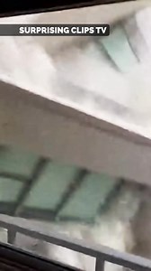 High Rise Slowly Tilts Before Collapsing Across Narrow City Street | Surprising Clips TV