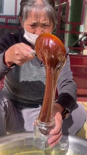 an easy and fast way to put freshly processed brown sugar liquid into a glass container #viralshorts