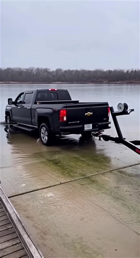 4.4K views | Pickup Slides Into Lake After Losing Traction on Boat...