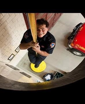 A Fireman Sliding down a Pole