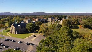 Beautiful aerial establishing shot of Berry College in Rome, Georgia, a classical Gothic English or British style college campus.