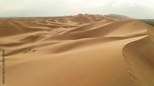Sunset over the sand dunes in the desert