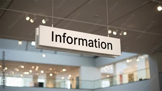 Sign Hanging in a Modern Space Indicating 'Information' with Indoor Lighting in a Contemporary Building Featuring Open Areas and Glass Railings