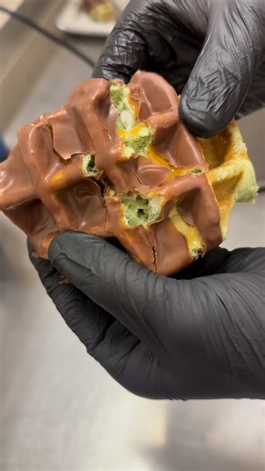 Bruges Belgian Bistro on Instagram: "Our brand new Caramel Apple waffle 🍏 Made with an apple flavored dough, drizzled with caramel, then dipped in rich Belgian milk chocolate.🍫 BrugesShop.com #brugeswaffles"
