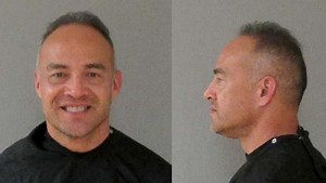 Teacher charged after video shows him lifting teen, carrying him out of classroom