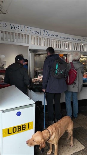 Fishmonger Mark Lobb and the queue waiting to be served his beautiful fresh fish"