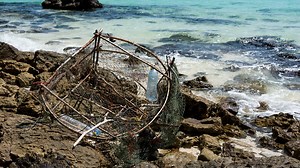 What is a ghost trap and why do they threaten marine life?