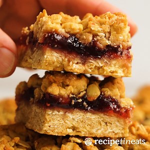 The charm of a crumble pie but in convenient hand-held form, Raspberry Jam Oat Bars have a buttery oatmeal base, a layer of jam, then topped with a crumble. 😋 LINK TO RECIPE 👉https://www.recipetineats.com/easiest-ever-raspberry-jam-bars/ | RecipeTin