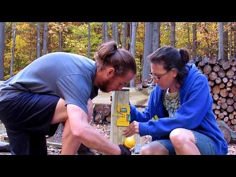 Connecting 4x4 posts on bracket on footer or 6x6 posts leveling