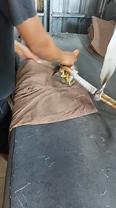 The process of ironing trousers using a large steam iron, before entering the packing so that the trousers are neat #convection #homeindustry #reels | Mannuvers