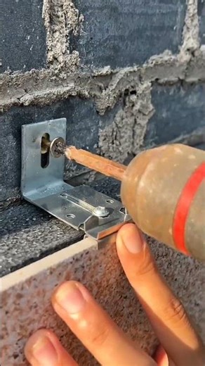 This is the process of installing ceramic tiles to cover brick walls to make them look better.#short