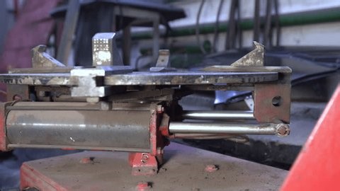 clip-4005090139-mechanical-device-visible-on-workbench-workshop-details