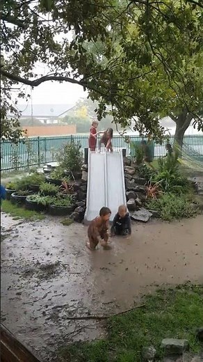 Children Play in Mud Puddles as Severe Weather Lashes New Zealand