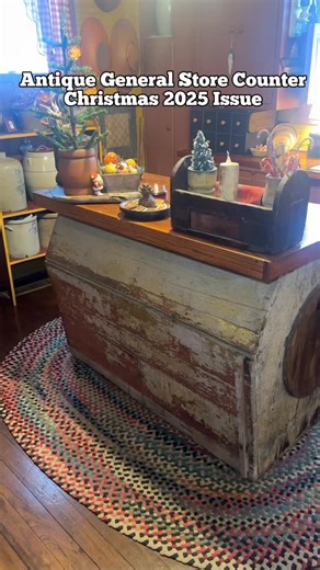 Giving history a new purpose: This old general store counter has been beautifully repurposed as a one-of-a-kind kitchen island. It was one of Jeff and Greta Dycus’ incredible auction finds. Their home will be featured in the Christmas 2025 issue of A Primitive Place magazine, which was released on October 28th. | A Primitive Place Magazine
