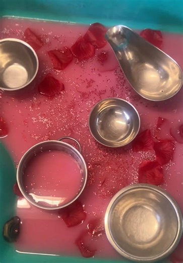 Love potions in the making today 💕🧪 Our little explorers mixed, poured and stirred their very own “love potions” using water, glitter and petals — building fine motor skills, language and imagination through sensory play. Lots of scooping, measuring and magical moments along the way ✨ Play creativity a little sparkle = the perfect recipe ❤️ #LovePotions #ValentinesActivities #SensoryPlay #MessyPlay #EarlyYears