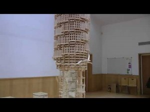 Toppling a Giant Domino Tower 2 Stories High