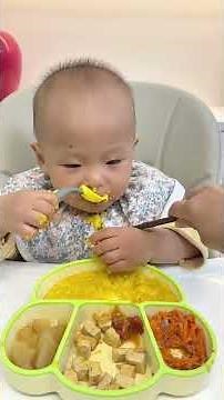 16-month-old baby eating independently, immersive mealtime is very soothing