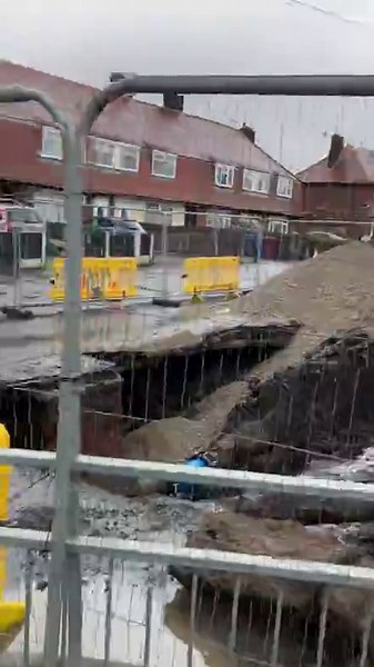 Huge sinkhole shuts off Manchester road with nearby homes hit by issues
