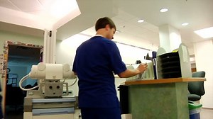 clip-4828379-mobile-x-ray-machine-radiology-test-being-used