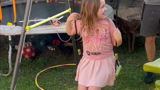 Girl runs inside after ice bucket challenge leaves her frozen on the swing