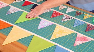 Katrina suggested we make a video about her easy method for making great-looking bunting that minimises waste fabric! After a customer came into our store in Cornwall looking for fabric to make bunting, Katrina suggested this method which she was amazed by! It's super simple and if it helps save waste we are all for it. | The Sewing Studio UK