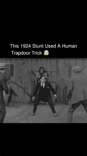 0oy.45 on Instagram: "This looks like a camera trick or early editing, but it is actually a masterpiece of practical engineering and physics.​The trick relies on simple geometry rather than video overlays. The assistant is not standing up; they are actually positioned horizontally on a hidden support beam behind the fence. The upper body is visible above the cut, but the rest of the body is suspended backward, leaving a massive physical gap in the middle.​To complete the illusion, they used a we