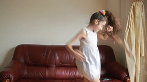 little cute girl dancing and fooling around at home
