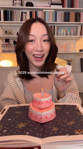 AmandaRachLee | my 2025 accomplishment cake except i made it out of paper so i could keep it forever 🥹💕 i often forget to celebrate my wins so this was a... | Instagram