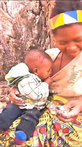 A beautiful young mother from the tribe trying to soothe her crying baby. #reelfb #life #hadzabetribe #hadzabe #adventure #followers #enjoy #BoomChallenge #Boomnow #Toptrending | Hadzabe Tribe Woman
