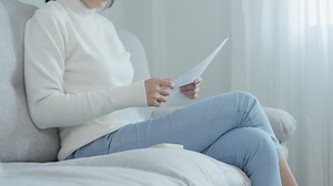 Download Modern woman use phone to scan barcode or QR codes to pay credit card bill after receiving document invoice online. payment, receive, paying electricity, digital payments without money, technology for free