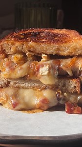 THE sandwich of fall 🍂 when you combine brie, bacon onion jam & fig spread then toast until gooey you’ll have the most addicting sandwich ever! Ingredients 8 strips bacon, diced 1 yellow onion, thinly sliced 1/4 cup maple syrup 2 tablespoons balsamic vinegar 4-6 slices of brie cheese 2 slices bread Fig jam spread Butter Directions: Heat a skillet to medium heat. Add diced bacon and cook until pieces begin to brown, then remove & place on a paper towel lined plate. In the same skillet, add onion