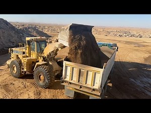 "Caterpillar F980 Wheel Loader Loading Mud & Stone into Actros Truck Trailer!"