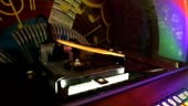 Jukebox automatically rearranging discs for playing music when coin...