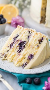 This Lemon Blueberry Cake is the perfect dessert for spring celebrations and get-togethers! Each layer is studded with blueberries and frosted with a bright and refreshing lemon icing. Want the recipe? Comment “recipe” below! 👇 | Sugar Spun Run