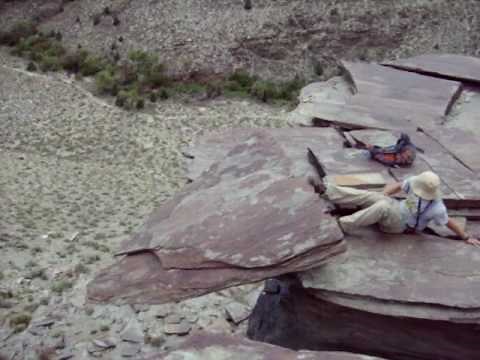 Rupert kicks huge rock off a cliff