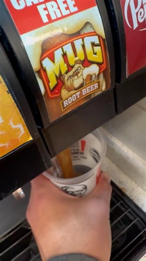 Mug root beer soda drink refill at KFC Kentucky Fried chicken soda, fountain machine