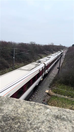 LNER Class 800 “Azuma” passes under a bridge at high speed