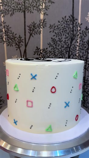 PlayStation theme birthday cake to unlock a new level. Piping the icons was a challenge, but the hardest was getting straight lines on the PS5 controller 🎮🎂 #gaming #ps5 #cake #birthday #fyp
