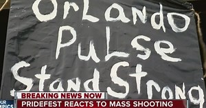 PrideFest attendees stand in solidarity