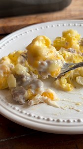 Sausage Gravy Breakfast Casserole This hearty breakfast casserole has layers of deliciousness in every bite. The combination of potatoes, eggs and sausage is the perfect balance especially when topped with a creamy peppered gravy. It’s a down home breakfast that’s sure to please even the hungriest appetites. 3 cups frozen cubed hash browns 2 tablespoons melted butter Salt and pepper 6 eggs 1/4 c milk 2 tablespoons butter 12 oz breakfast sausage cooked 1 packet pepper gravy mix prepared according