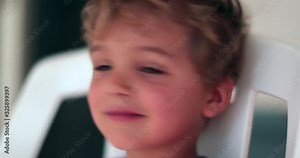 Little blonde boy waving his head and saying no. Kid shaking head in disagreement refusing offer