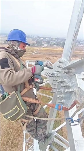 Precision Engineering Working on the Steel Structure of a Utility Pylon