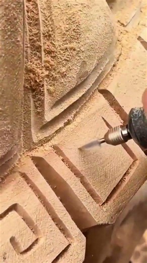 making wood carvings using rotary tools with precision and artistic details on the wooden surface